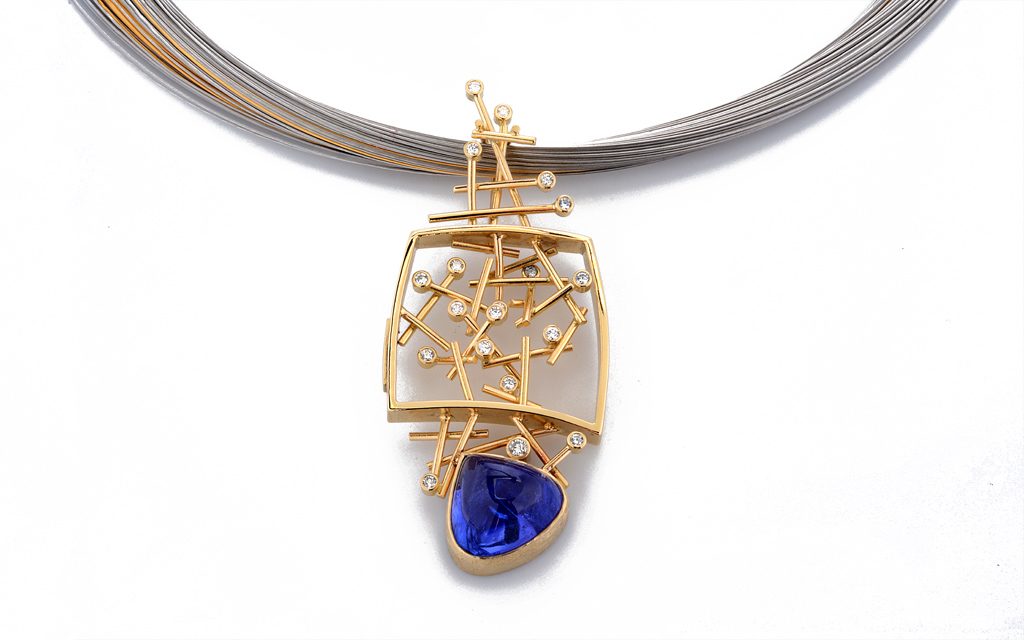 8108N - 18 karat yellow gold fabricated necklace set with a beautiful 11.87 carat Tanzanite Cabochon and .41cttw. Diamonds (14.4g) Price Upon Request
